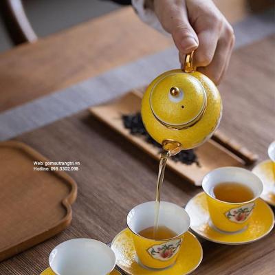 BỘ ẤM CHÉN QUẢ ĐÀO MEN VÀNG